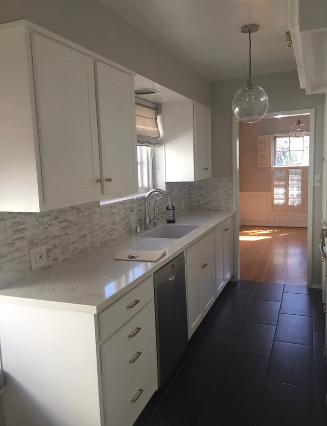 Kitchen looking on the the bright lighted Dining Room with beautiful crown moulding - 3037 Motor Ave