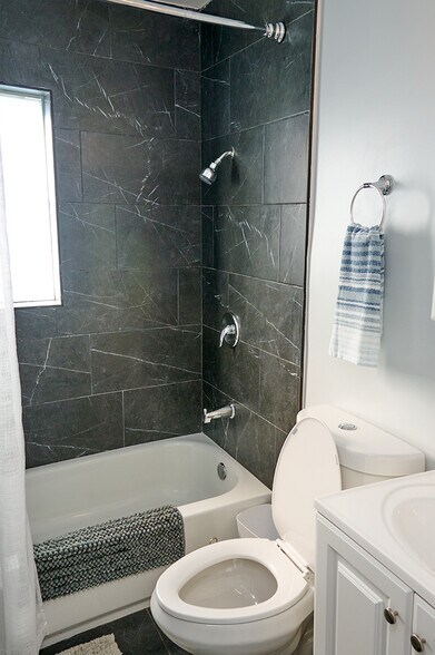 Renovated bathroom with shower and tub - 126 S E St