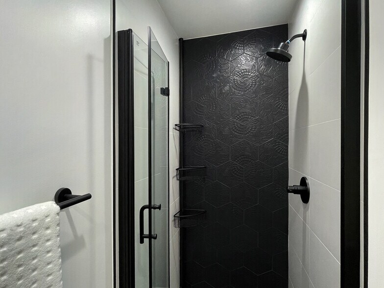 NEW elegant shower with folding glass door & Delta 5-setting shower head - 9047 Langdon Ave