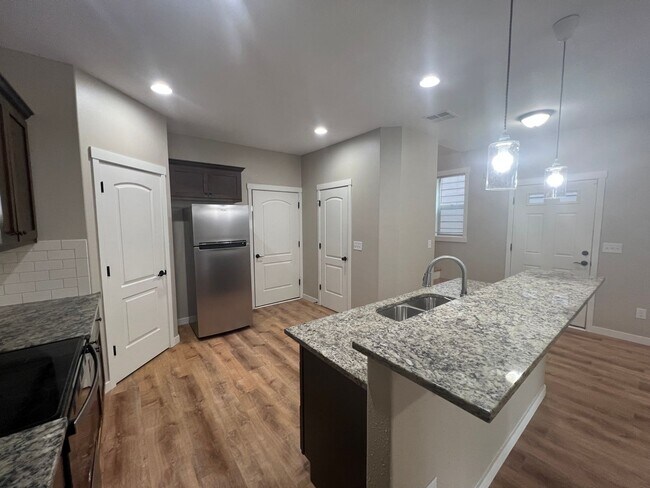 Building Photo - Recently Renovated! Spacious 3 Bedroom Home with Fenced Yard, Patio, and 2-Car Garage With Move I...