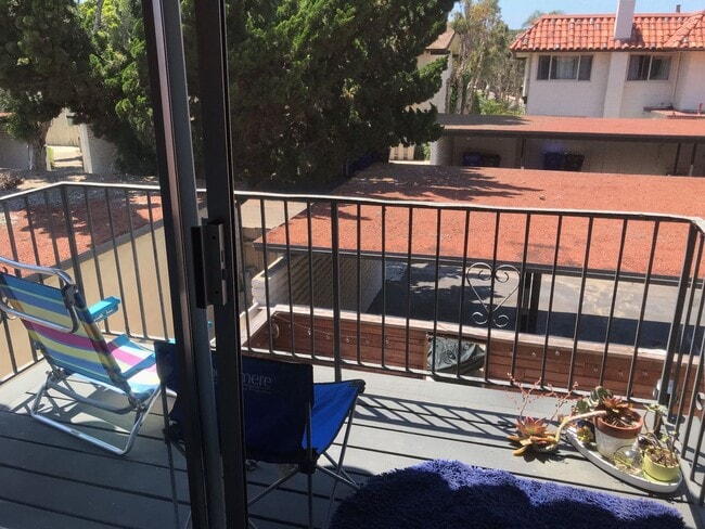 Building Photo - Beautiful Townhome with large fenced back patio, second story balcony, and two covered parking spots