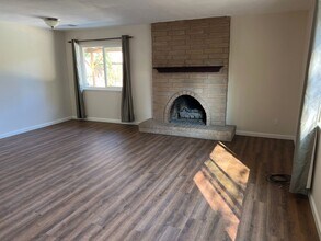 Building Photo - Four bedroom two bathroom home with a pool...