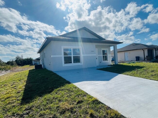 Building Photo - Brand-New 2BR/2BA Home with Lanai on Oversized Lot – Desirable SW Lehigh Acres