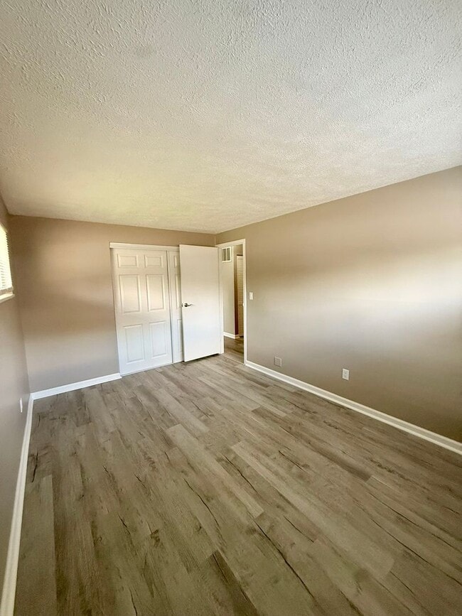 Building Photo - Move-In Ready 2BR with Stunning Granite + Fenced Backyard