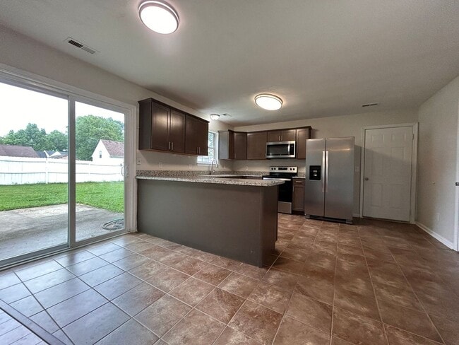 Building Photo - Spacious & Updated 4-Bedroom Gem in the He...