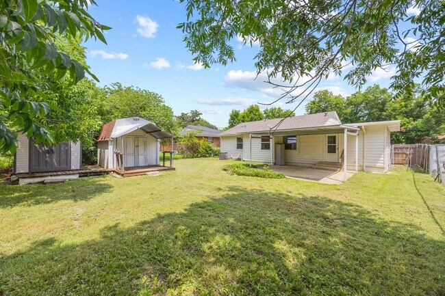 Building Photo - **$40K+ IN UPGRADES AND A FENCED BACKYARD WITH TWO STORAGE BUILDINGS**
