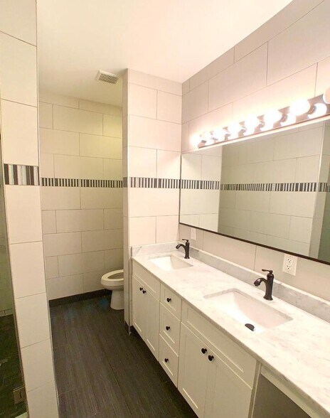 bathroom with double vanity - 1213 Noble St