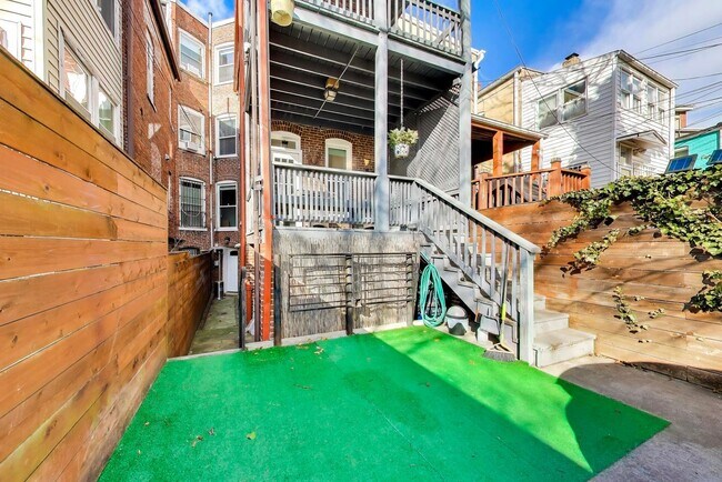 Building Photo - COMING SOON - Sprawling 5 Bed, 3 Bath, Two Kitchens, Dual Back Decks, Two Office/Den Townhouse, 2...