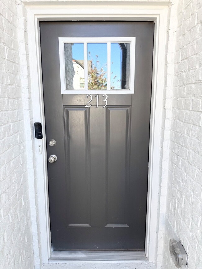 Building Photo - Stylish 3BR Townhome with Private Yard & T...