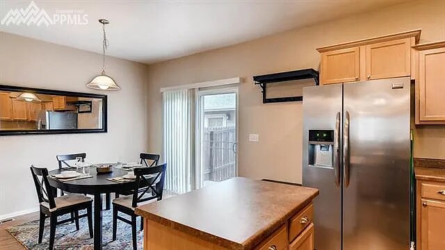 dining area with walk out to private fenced in courtyard - 3549 Bay Owl Grv