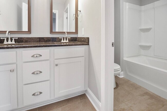 Building Photo - Pet Friendly Three Bedroom with Bonus!