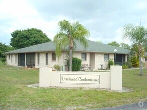 Building Photo - Single Story walk up Condominium close to ...