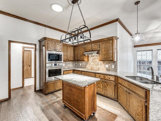 Building Photo - 4 Bedrooms - 3 Bathrooms - 3 Car Garage - ...
