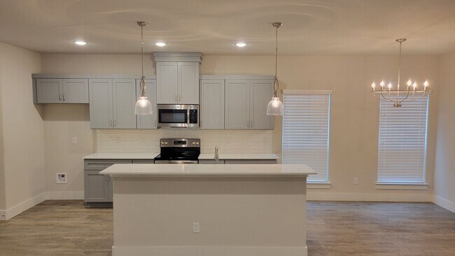 Building Photo - 3/2/2 CUSTOM FEATURES - OPEN CONCEPT - GOD...