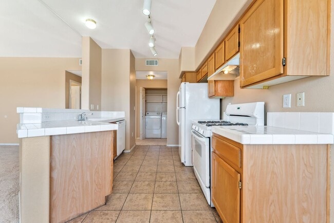 Building Photo - Bright & Stylish Condo with Fireplace and Private Balcony in a Resort-Style Community!