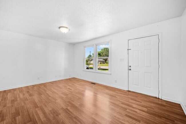 Building Photo - Spacious Yard + Fresh Interior Updates!