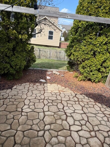 back patio with fenced in yard - 5020 Brittany Downs Dr