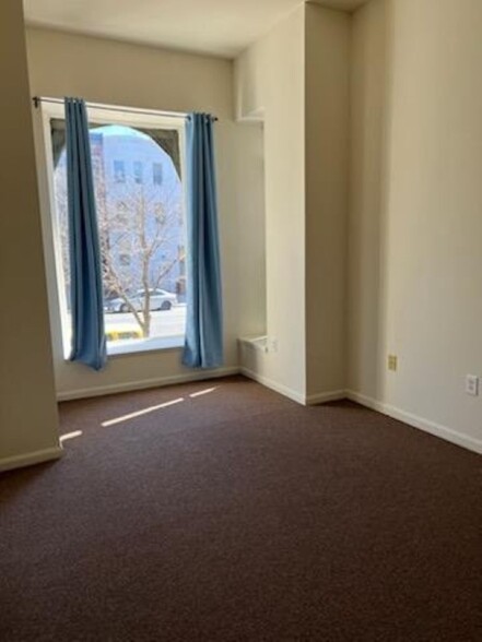 New carpeting and Large Eastern Exposure Bay window in front bedroom - 2634 N Charles St