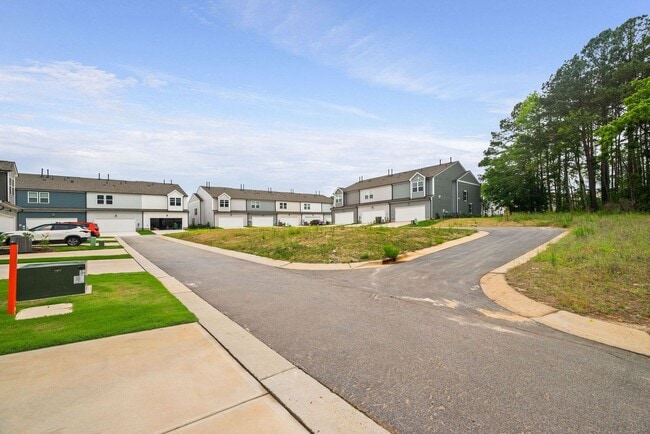 Building Photo - Stunning 3BD, 2.5BA End-Unit Fuquay-Varina Townhome with a 2-Car Garage in a Prime Location Near ...