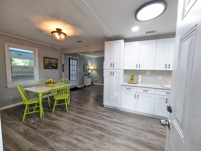 The kitchen has been recently renovated with modern amenities, stainless appliances, a dishwasher, l - 4107 Crane St