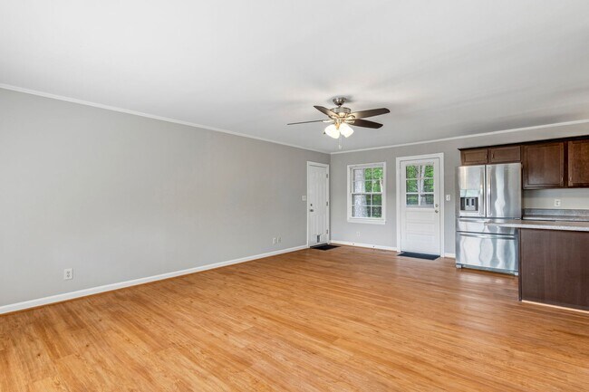 Building Photo - Updated Home, Stainless Steel Appliances, Wood Like Flooring, Deck, Garage!