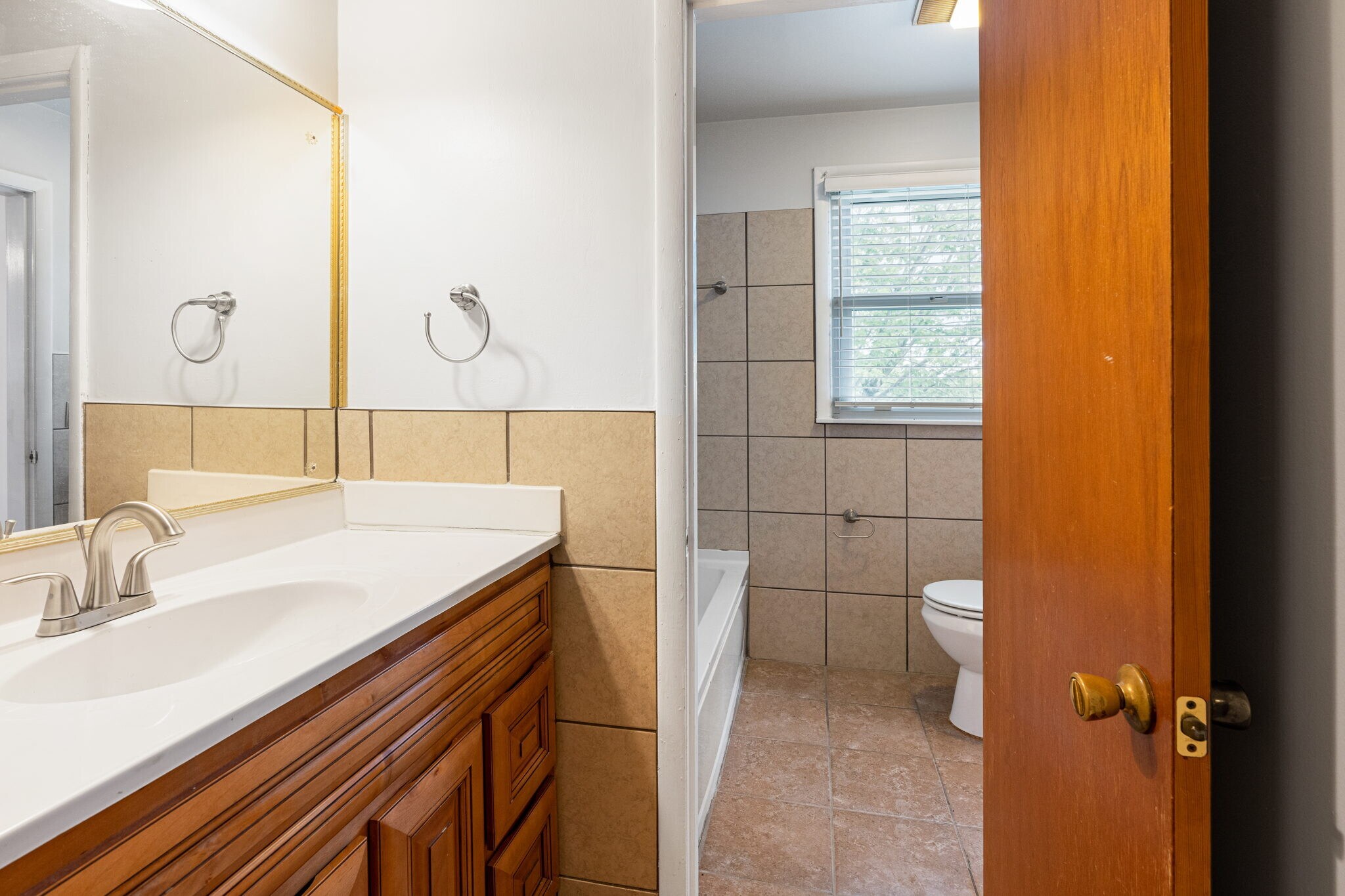 Bathroom 1 Sink with privacy door and door to hall - 3841 Dubois Dr