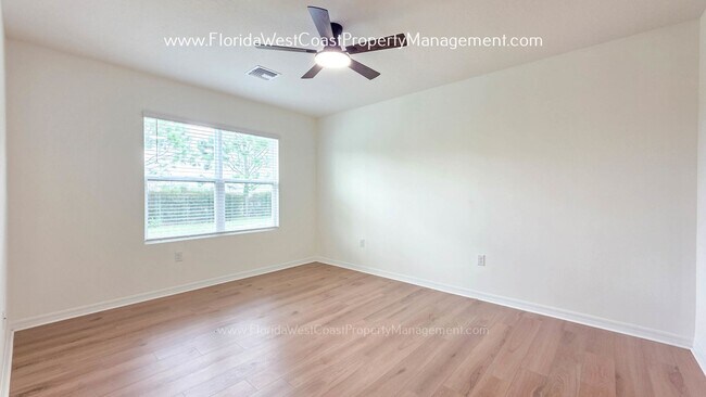 Building Photo - MOVE IN READY ! 4 BEDROOM/2 BATH! TILE- LVP THROUGHOUT! LAWN MOWING INCLUDED!