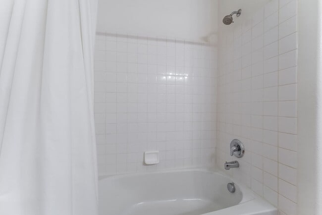 Building Photo - Charming Ground-Floor Condo with Wood Flooring & Modern Comforts!