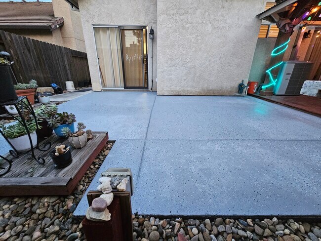 Outdoor Patio with brand new floor, beautiful pots of plants & garden host - 9316 Caulfield Dr