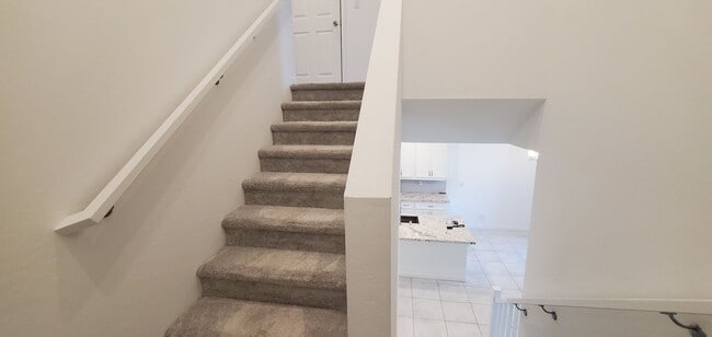 Building Photo - Beautiful townhome features a bright, open-concept layout