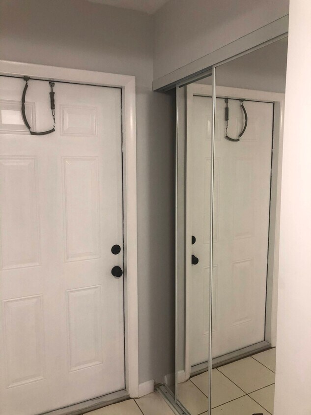 Entrance with closet and mirror door - 2825 SW 22nd Ave