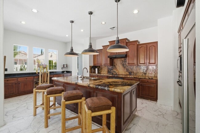 Building Photo - Private Gated Christopher Homes Estate in The Vineyards | Resort-Style Backyard & Strip Views
