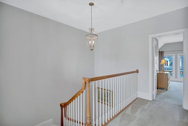 Building Photo - Stunning 4BR All-Brick End-Unit Townhome with Rooftop Terrace in Potomac Greens