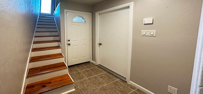 Entry area includes direct access to the garage and a coat closet - 6724 Eastridge Dr