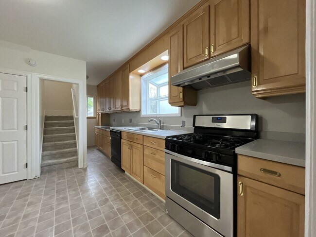 Building Photo - Character-Filled Concordia Home with Flexible Living Spaces & Gas Fireplace