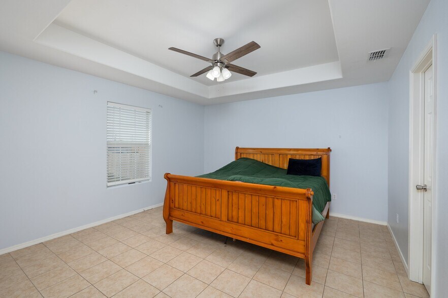 Master bedroom with private bathroom. - 5615 JJ Ln