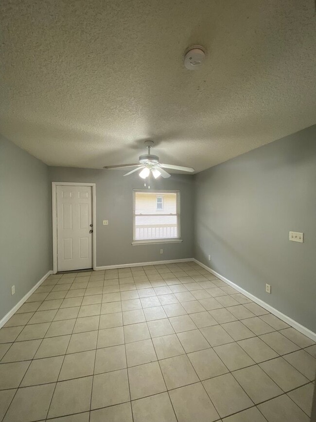 Building Photo - Beautiful 2/1B all tiled 2nd floor condo i...