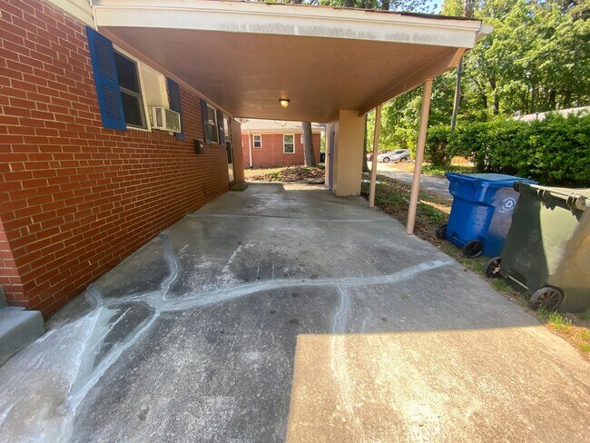 Building Photo - Private carport, in-unit laundry, and the Lakewood strip right outside your door.