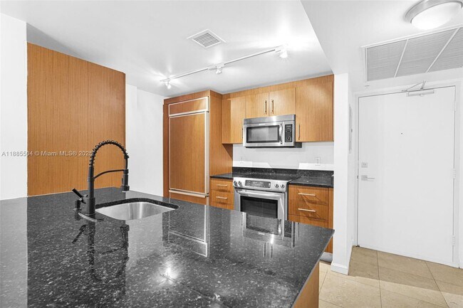 Building Photo - 10275 Collins Ave