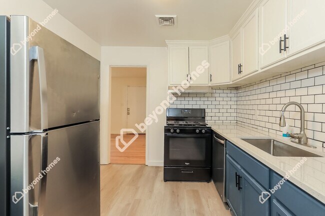 Building Photo - This Cozy 4 bedroom / 2 full bath and 2,09...