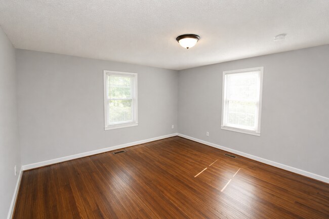 Building Photo - Updated Multi-Bedroom Home | Brand-New Deck | Circular Drive | Triad Premier Realty