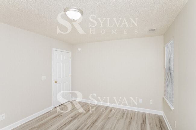 Building Photo - Welcome to this beautiful and sun-filled 3...