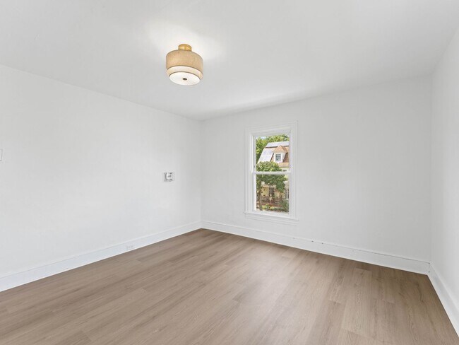 Building Photo - Renovated 3-Bedroom Apartment with Bonus Finished Attic & Spacious Shared Backyard