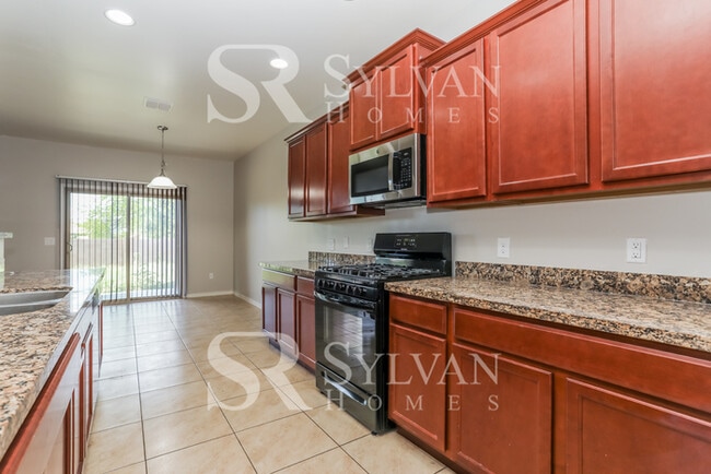 Building Photo - The living is easy in this 5 bedroom, 3 ba...