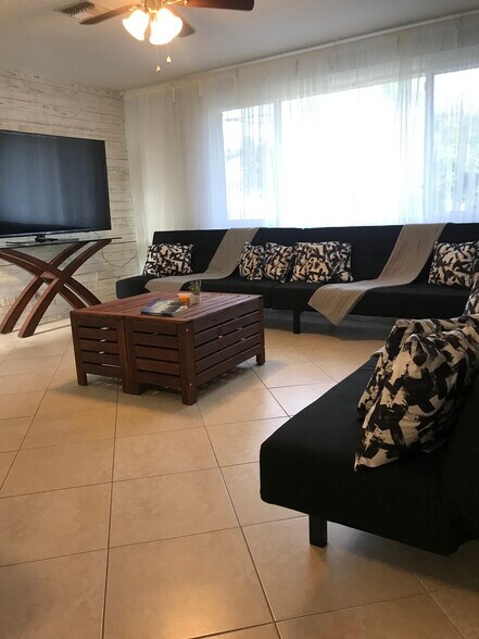 Living Room with 3 sleeping sofas if requested for additional charge. - 2440 Manasota Beach Rd