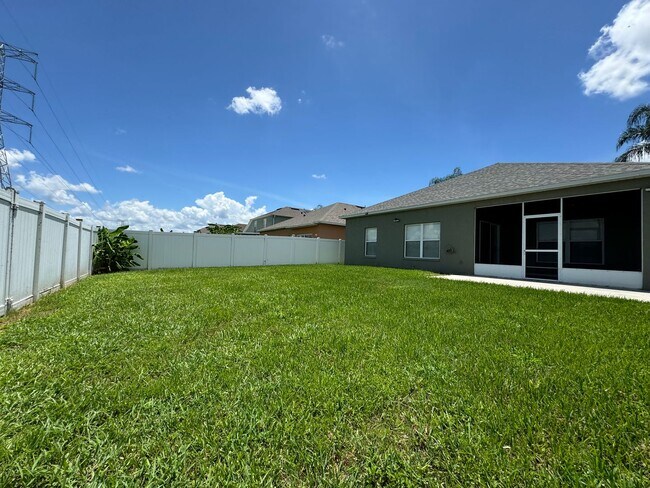 Building Photo - Beautiful 3/2 home near Lake Nona ~ Fenced In Yard ~ LVP & Tile Flooring ~ Community Pool!
