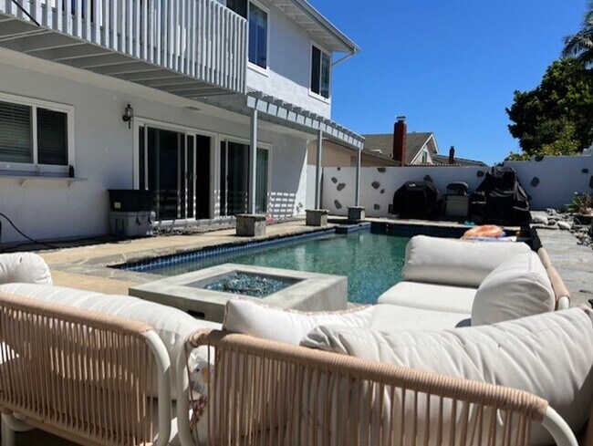 Building Photo - Coastal Elegance Meets Family Comfort in D...