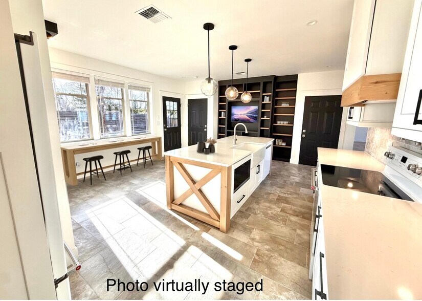 Virtually staged kitchen. Large area in kitchen could fit banquets, dining table, or bar seating - 24 Ash St N