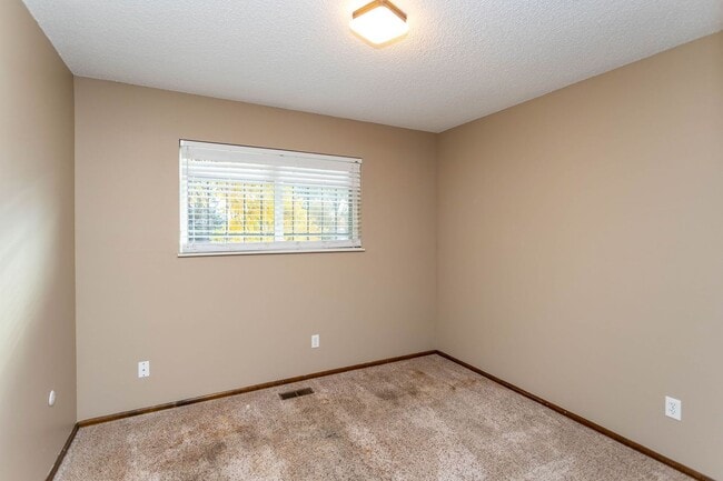 Building Photo - Comfortable Ranch-Style Living with Large Fenced Backyard!