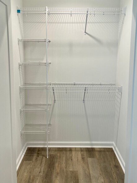 Primary closet, plenty of shelving - 2225 Kenwood Blvd SE